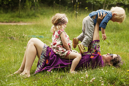 Mother and Children Playing in Field